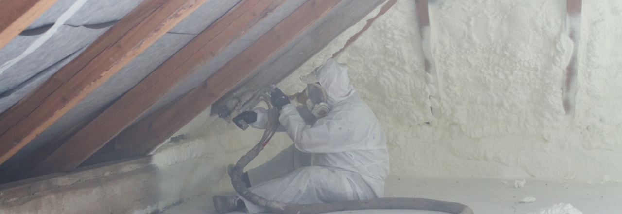 spray foam being installed in attic of home